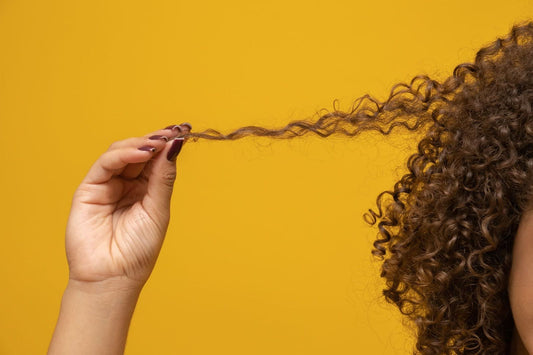 Woman with trichotillomania pulling her hair.