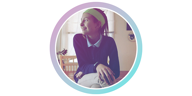 A photo of a girl holding a soccer ball.