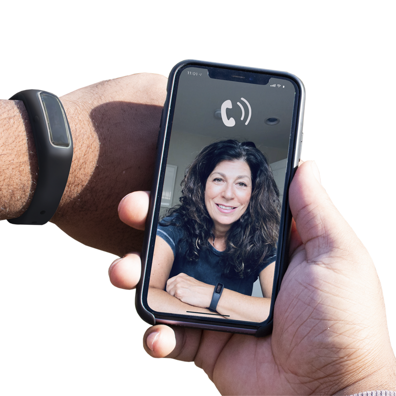 A person holding Virtual Peer BFRB Coaching with a woman's face on it.