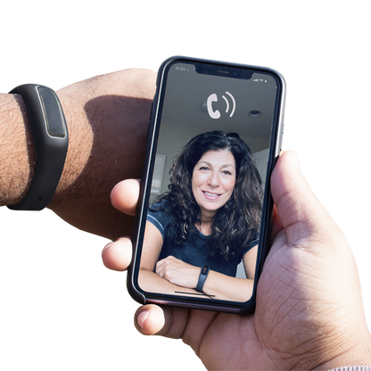 A person holding Virtual Peer BFRB Coaching with a woman's face on it.